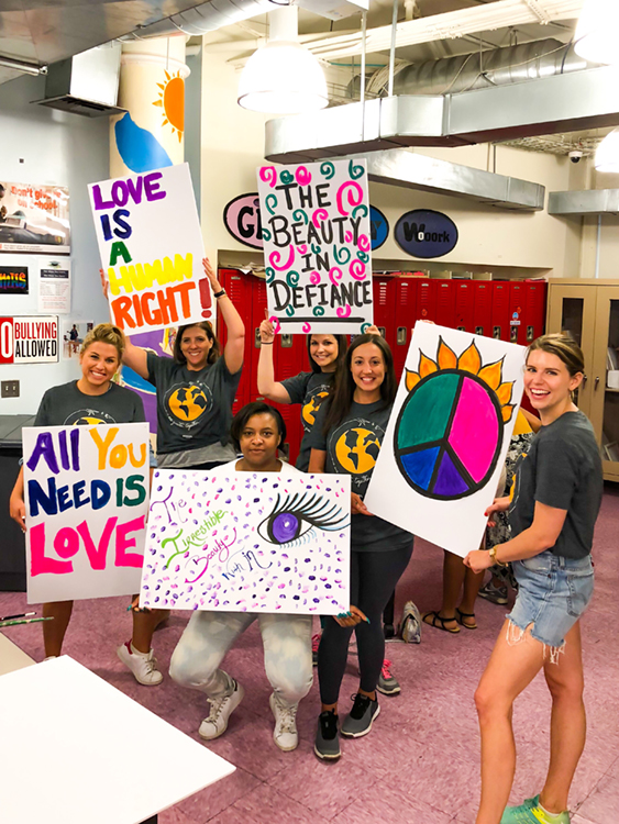 Fossil Group and Hetrick Martin employees make posters for NYC pride parade