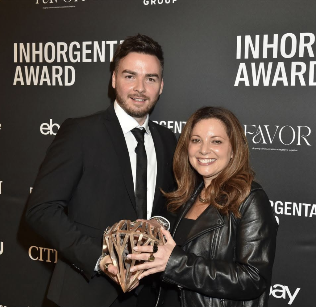 two people accept the inhorgenta award